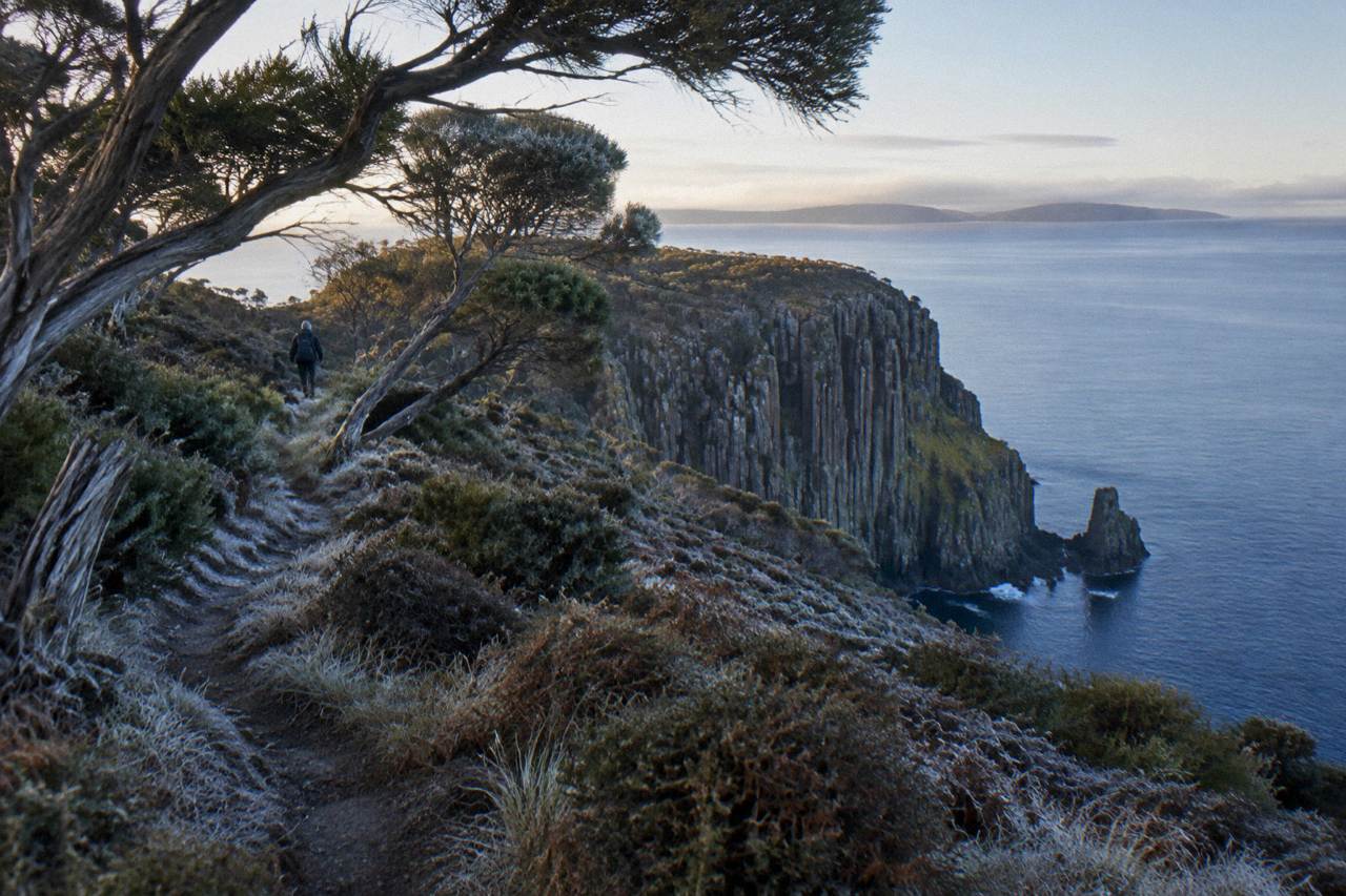 Bruny Island coastline with dolerite cliffs above calm blue water