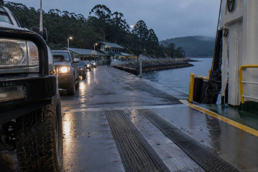 Cars queueing on the loading ramp at the Kettering ferry terminal with the vessel at the berth