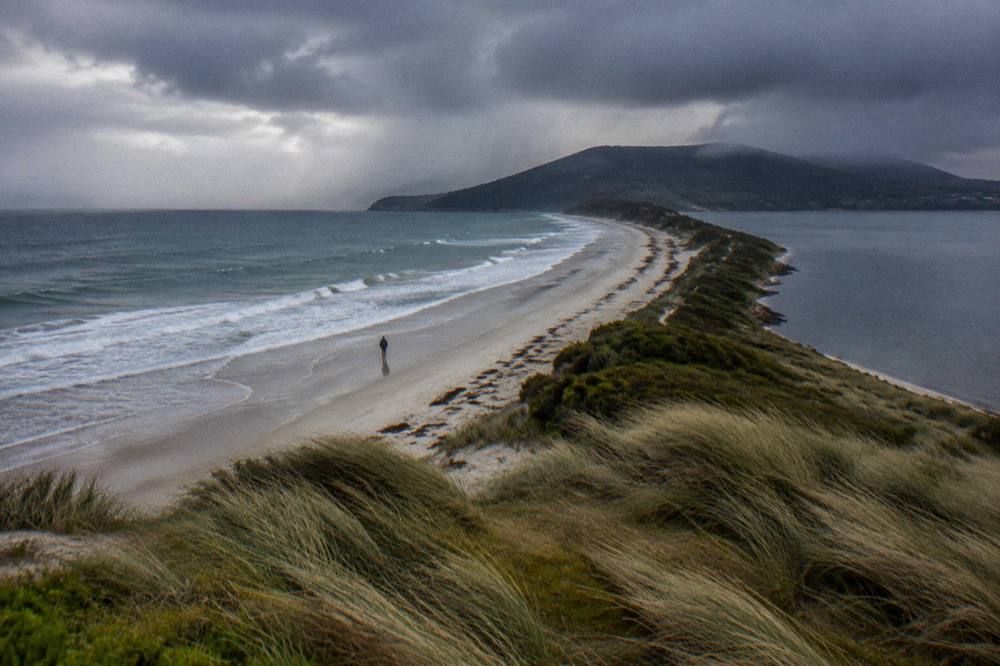 A view over the Neck isthmus joining north and south Bruny Island with a long sandy beach